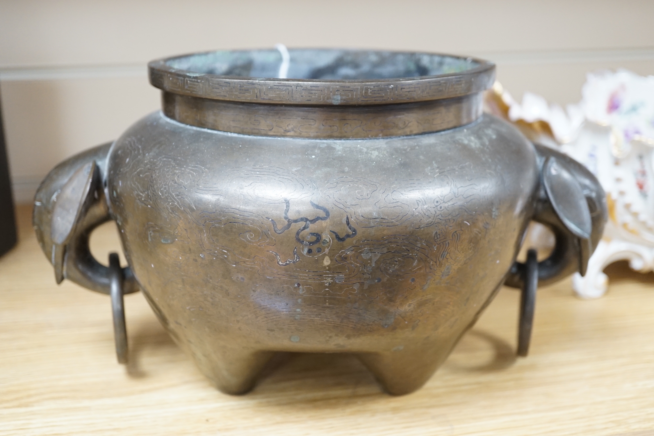 A large Chinese silver inlaid bronze elephant handled censer, signed Sishou, 19th century, 16cms high, 29cm wide